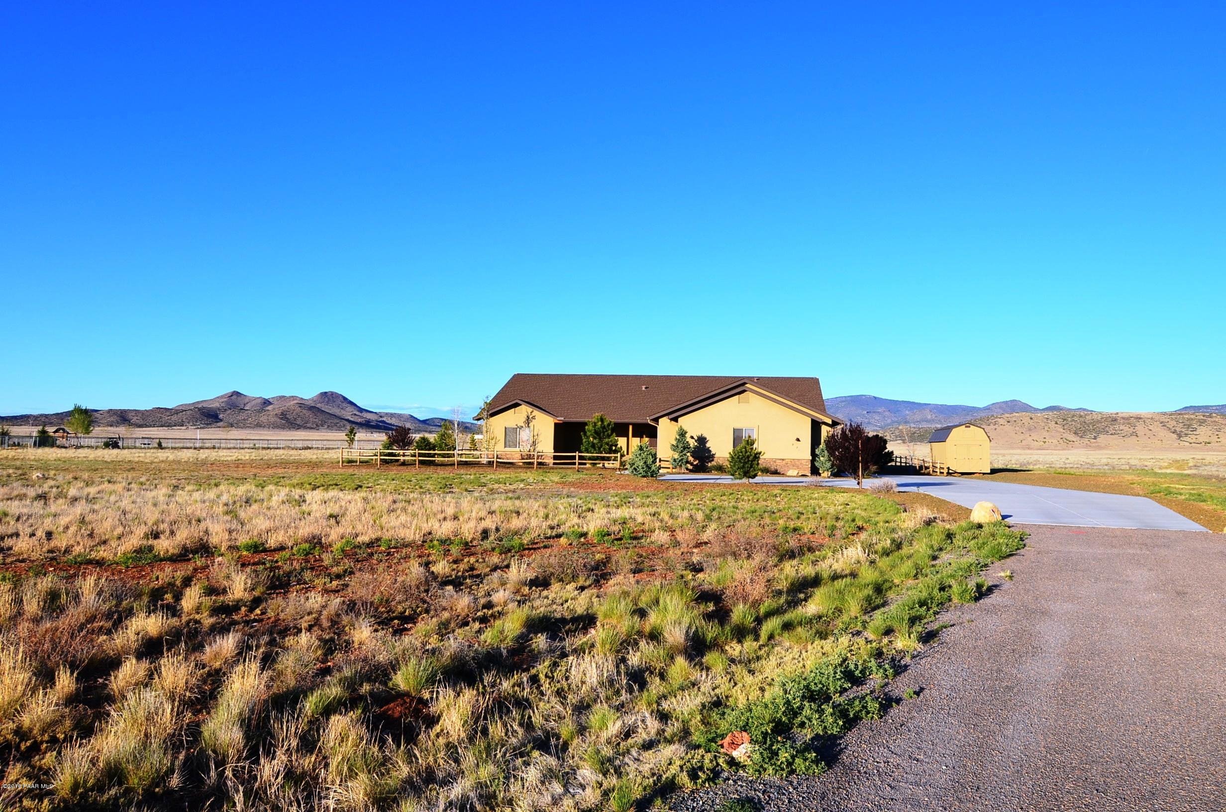 9474 Dows Ranch Road Prescott Valley, AZ 86315 - Photo 22 of 55 a view of a houses with a mountain