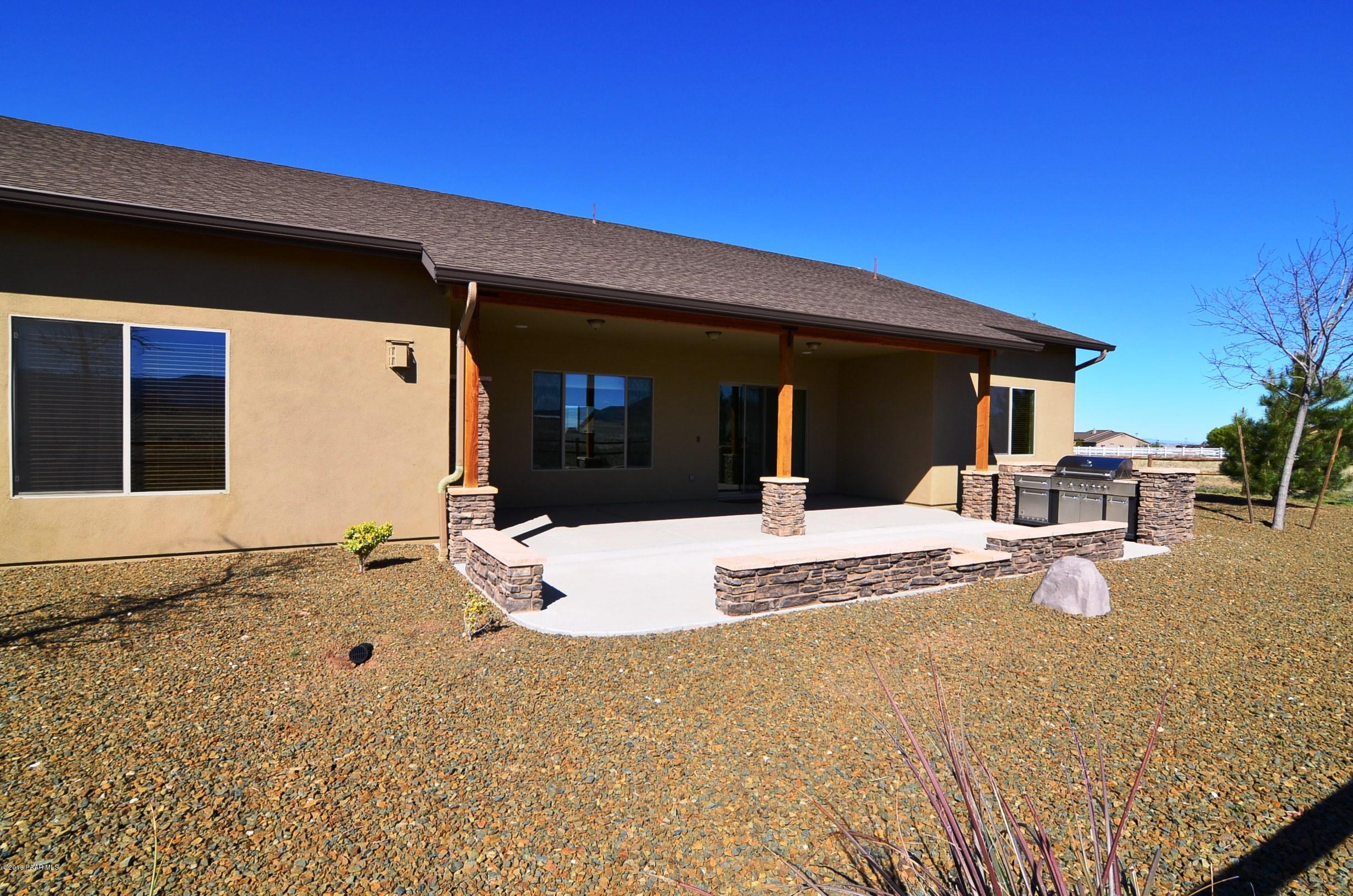 9474 Dows Ranch Road Prescott Valley, AZ 86315 - Photo 27 of 55 a view of a house with wooden floor
