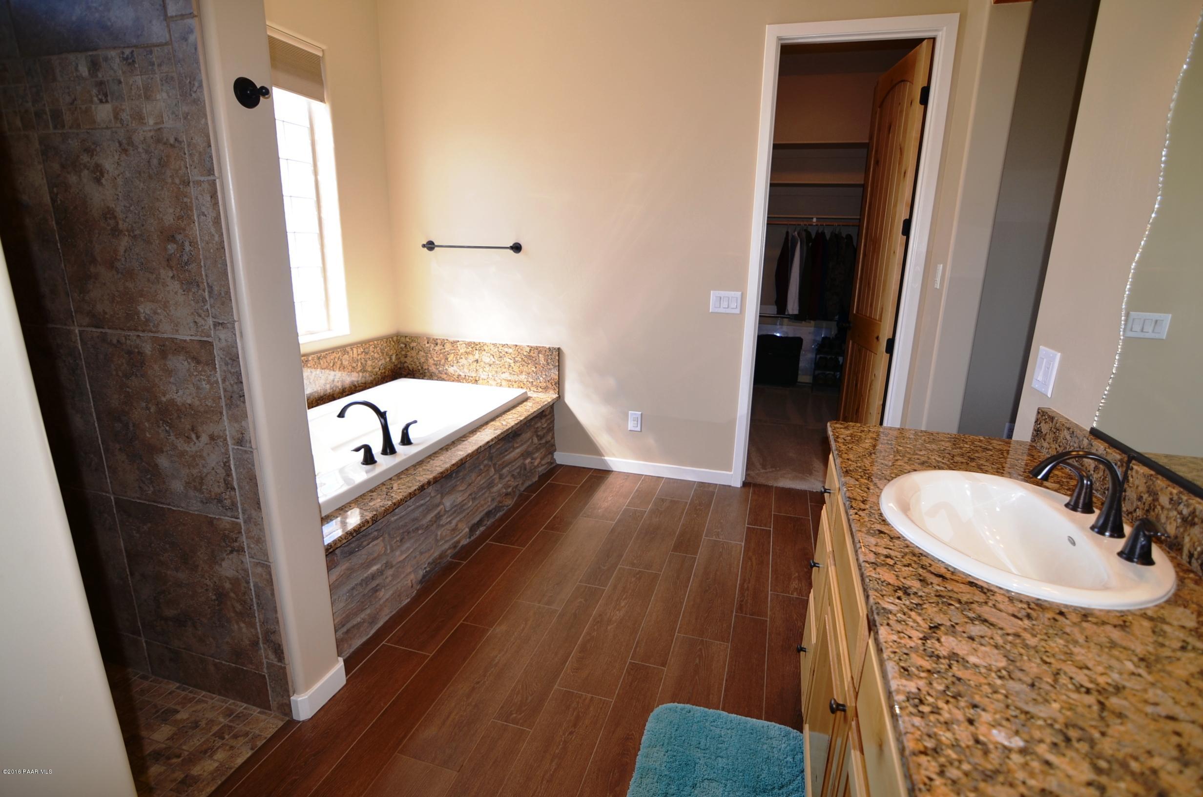 9474 Dows Ranch Road Prescott Valley, AZ 86315 - Photo 39 of 55 a bathroom with a sink and a mirror
