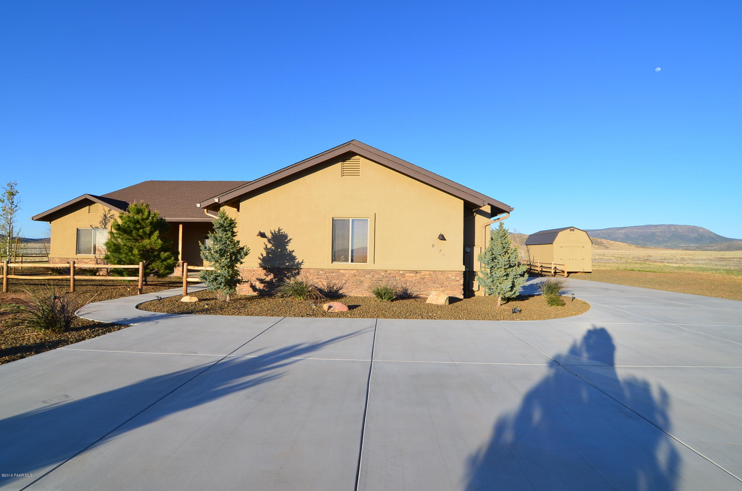 9474 Dows Ranch Road Prescott Valley, AZ 86315 - Photo 48 of 55 a front view of a house with swimming pool