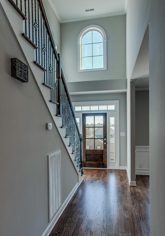 7314 Allans Ridge Lane Fairview, TN 37062 - Photo 2 of 30 a view of livingroom with wooden floor and stairs