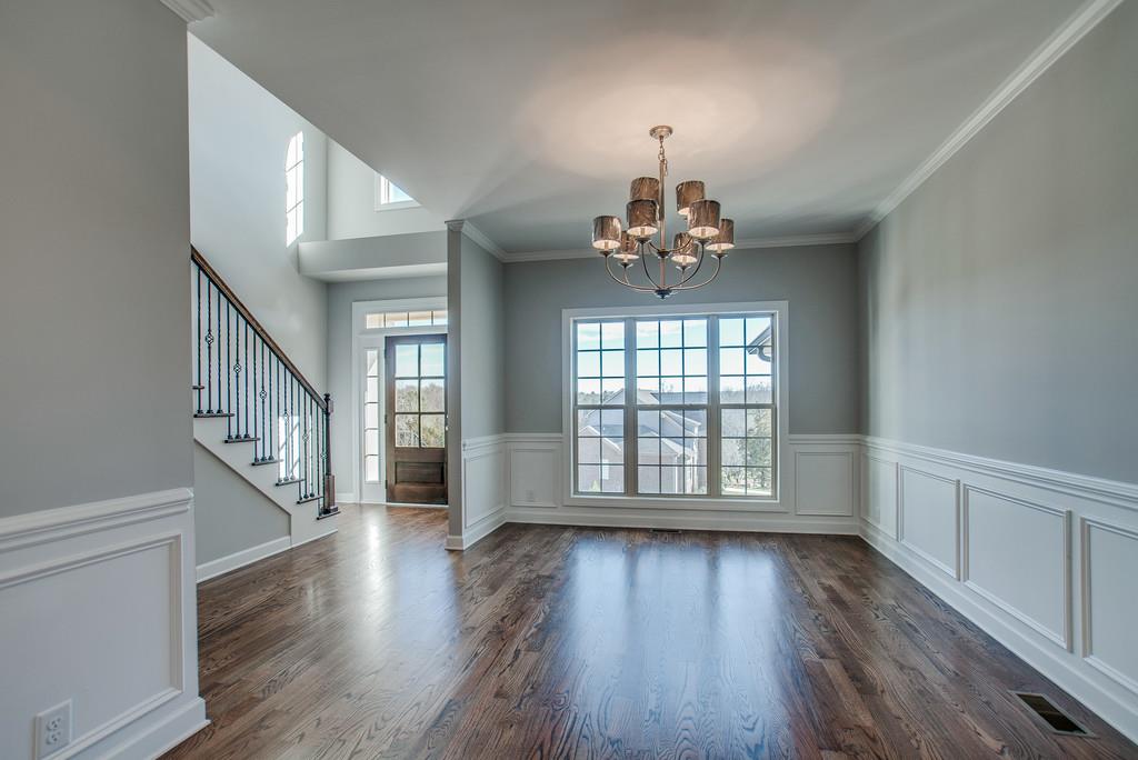 7314 Allans Ridge Lane Fairview, TN 37062 - Photo 4 of 30 a view of an empty room with wooden floor and a window