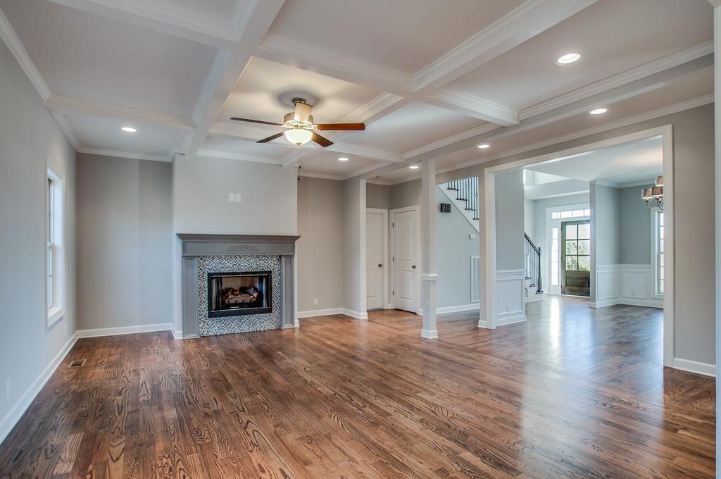7314 Allans Ridge Lane Fairview, TN 37062 - Photo 7 of 30 an empty room with wooden floor a fireplace and window