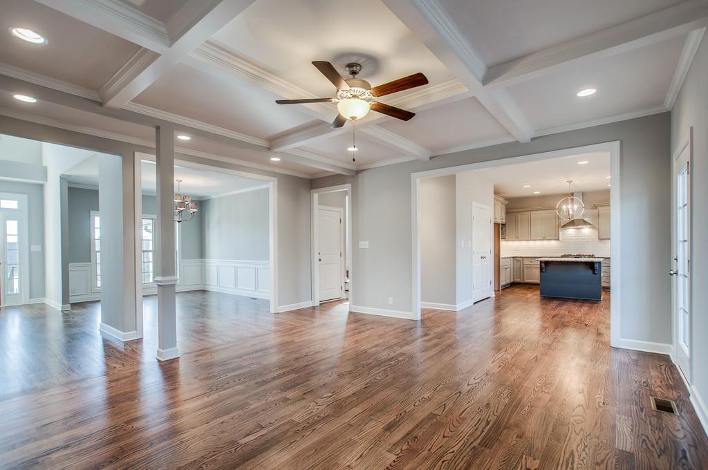7314 Allans Ridge Lane Fairview, TN 37062 - Photo 8 of 30 a view of an empty room with wooden floor and a ceiling fan