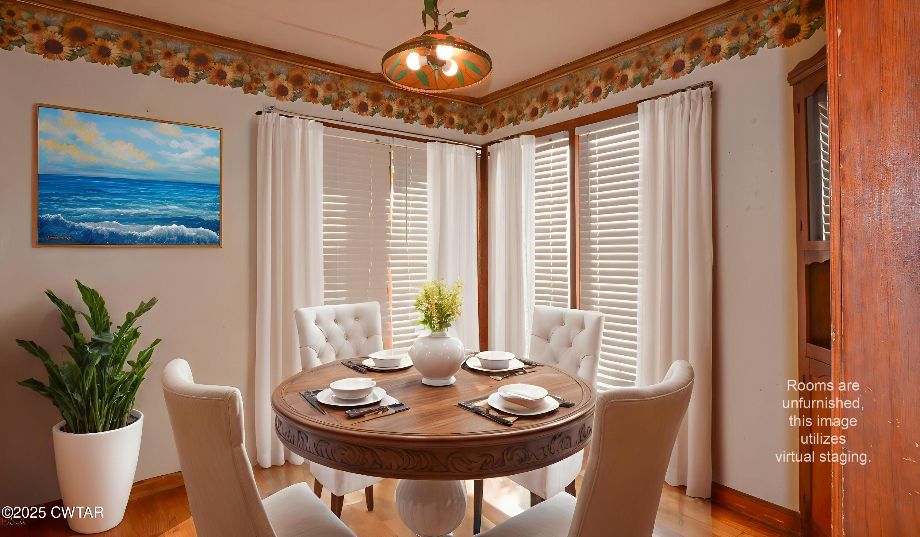 123 Sunset Drive Bells, TN 38006 - Photo 12 of 23 a dining room with furniture potted plants and wooden floor
