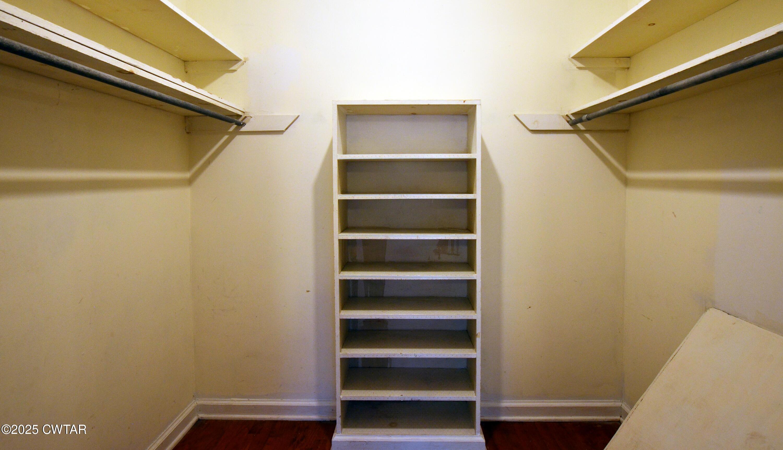 123 Sunset Drive Bells, TN 38006 - Photo 19 of 23 a view of walk in closet with empty racks