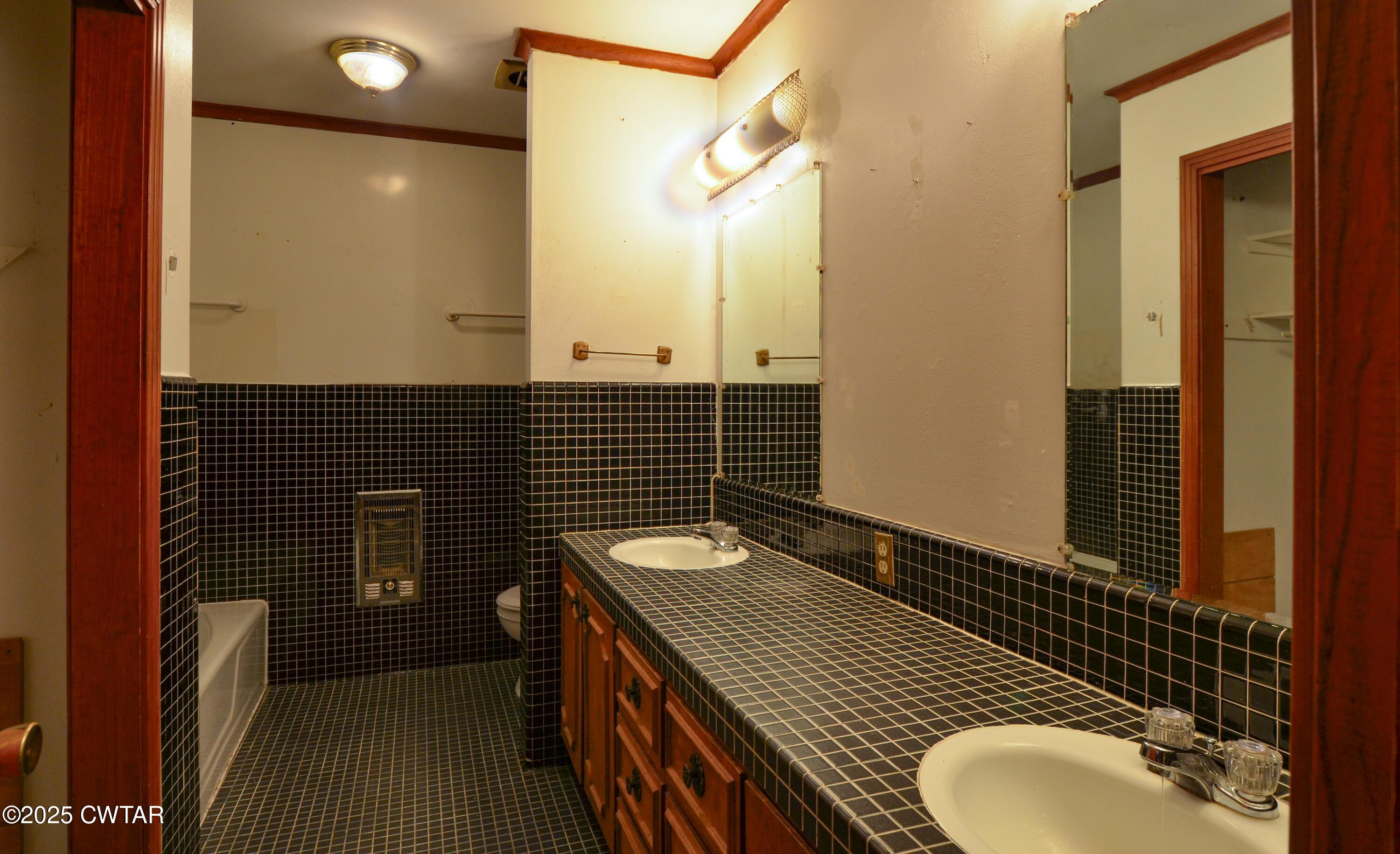 123 Sunset Drive Bells, TN 38006 - Photo 20 of 23 a bathroom with a sink and a mirror