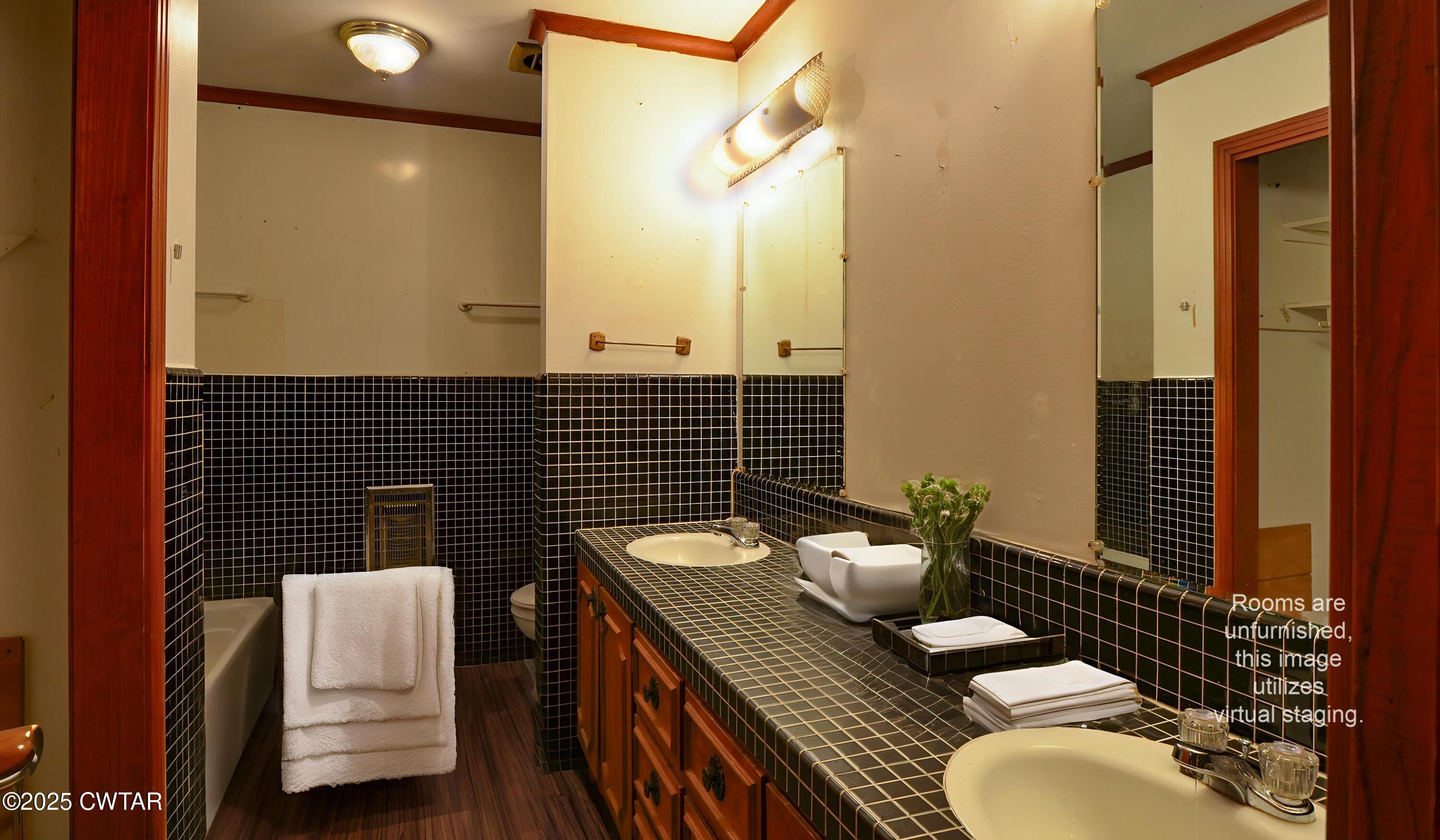 123 Sunset Drive Bells, TN 38006 - Photo 21 of 23 a bathroom with a sink mirror and toilet