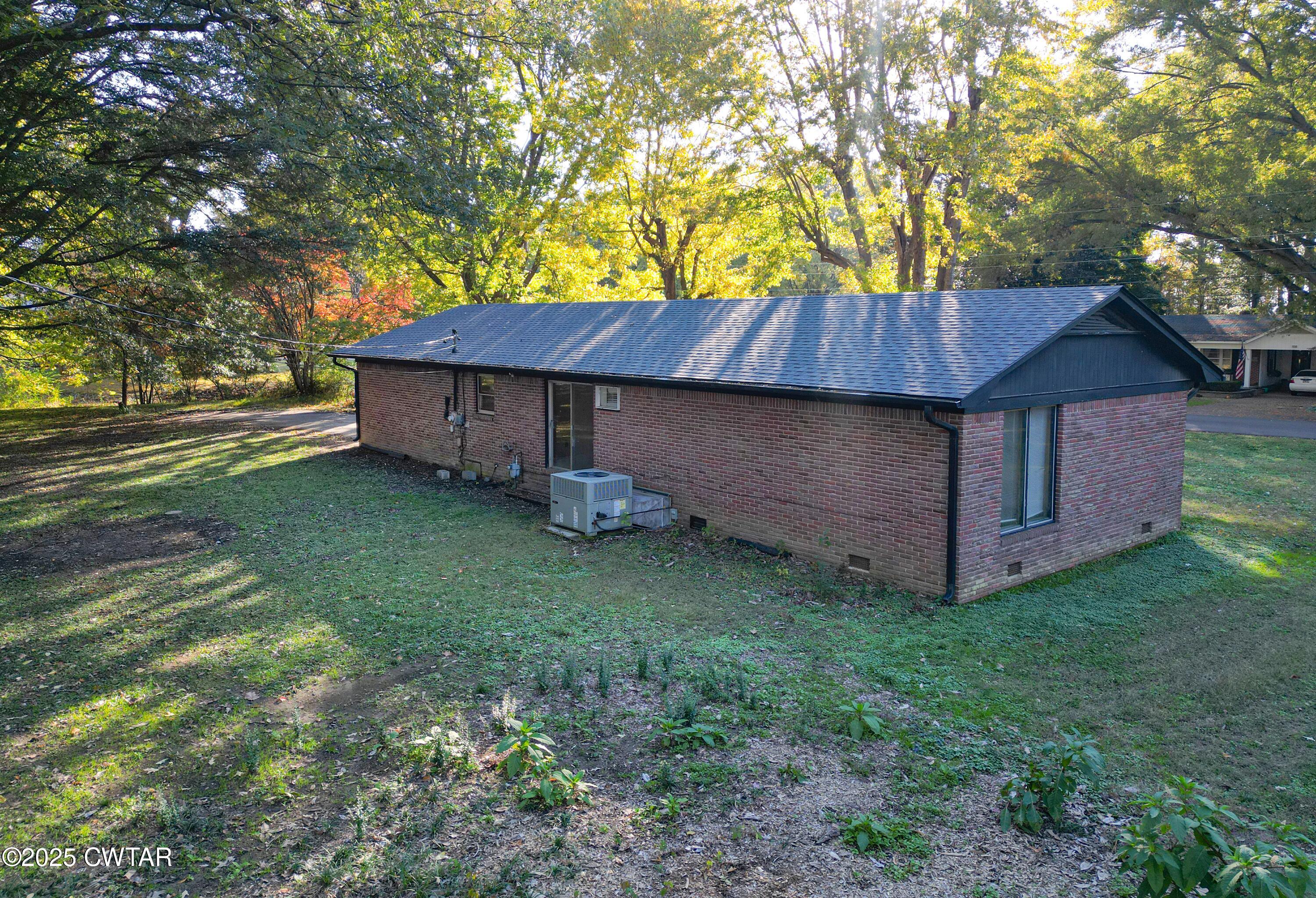 123 Sunset Drive Bells, TN 38006 - Photo 4 of 23 a house view with a garden space