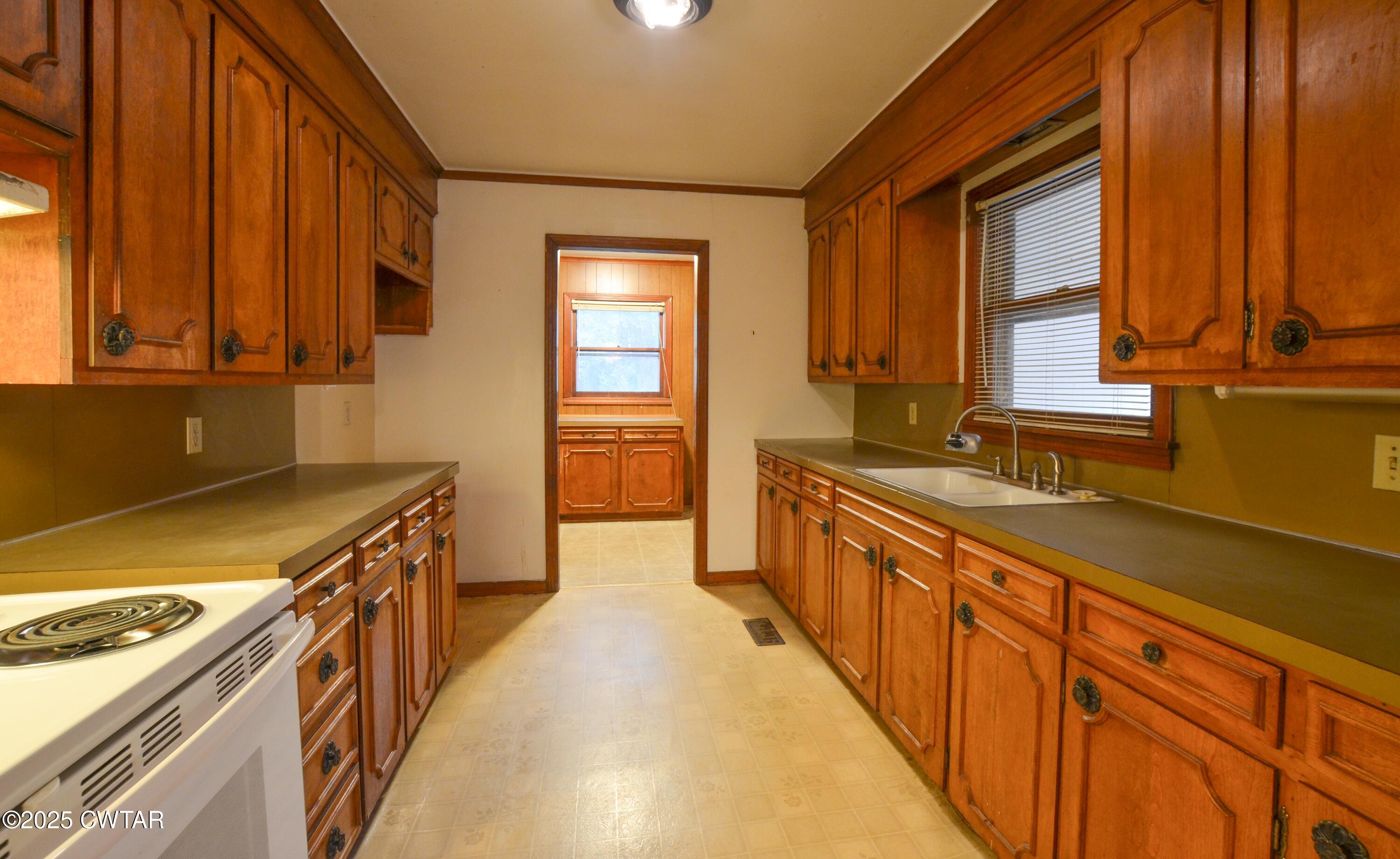 123 Sunset Drive Bells, TN 38006 - Photo 9 of 23 a kitchen with stainless steel appliances granite countertop a sink and a stove