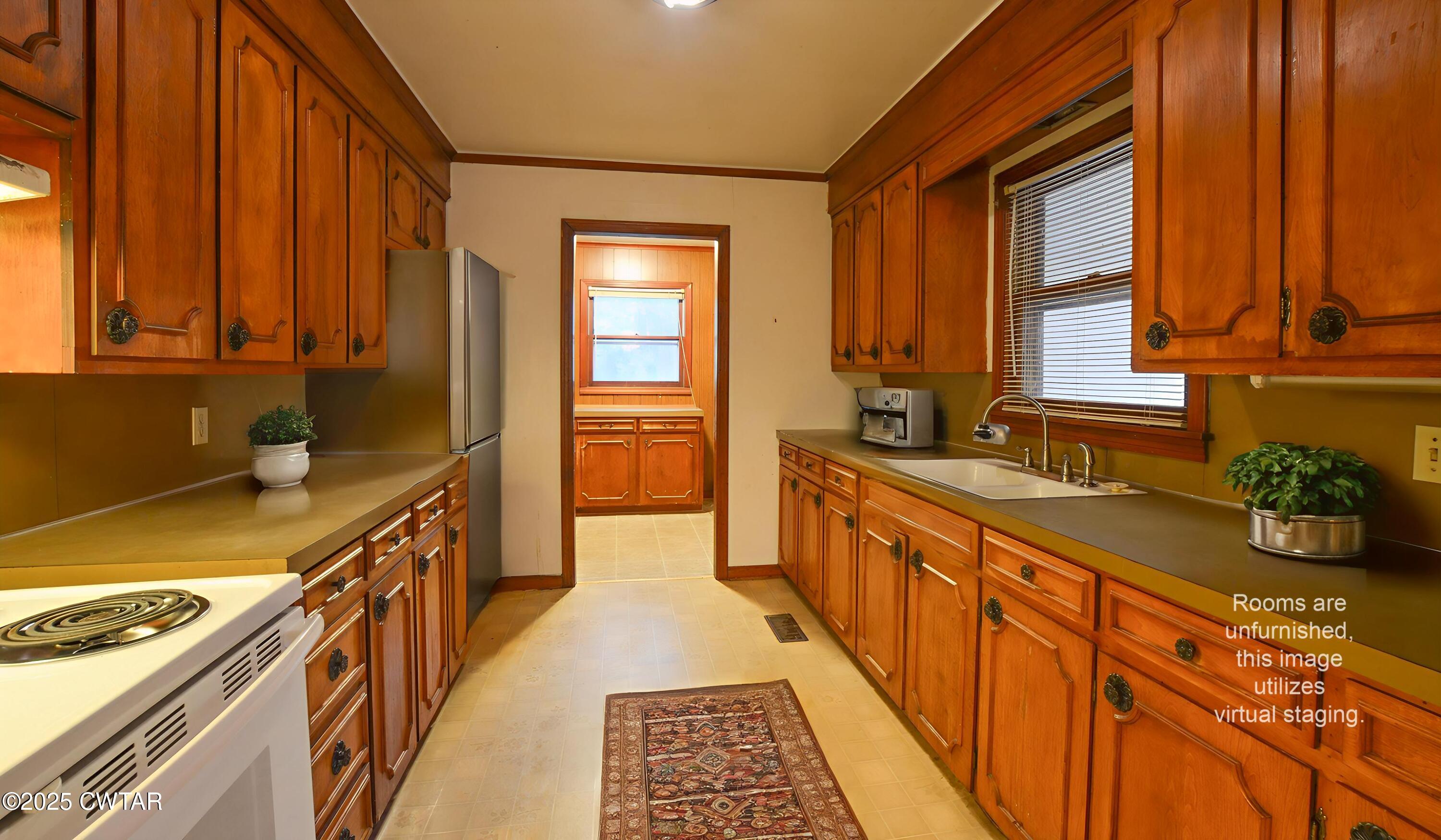 123 Sunset Drive Bells, TN 38006 - Photo 10 of 23 a kitchen with stainless steel appliances a sink stove and cabinets