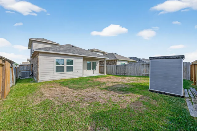 a view of a backyard with plants and a garden