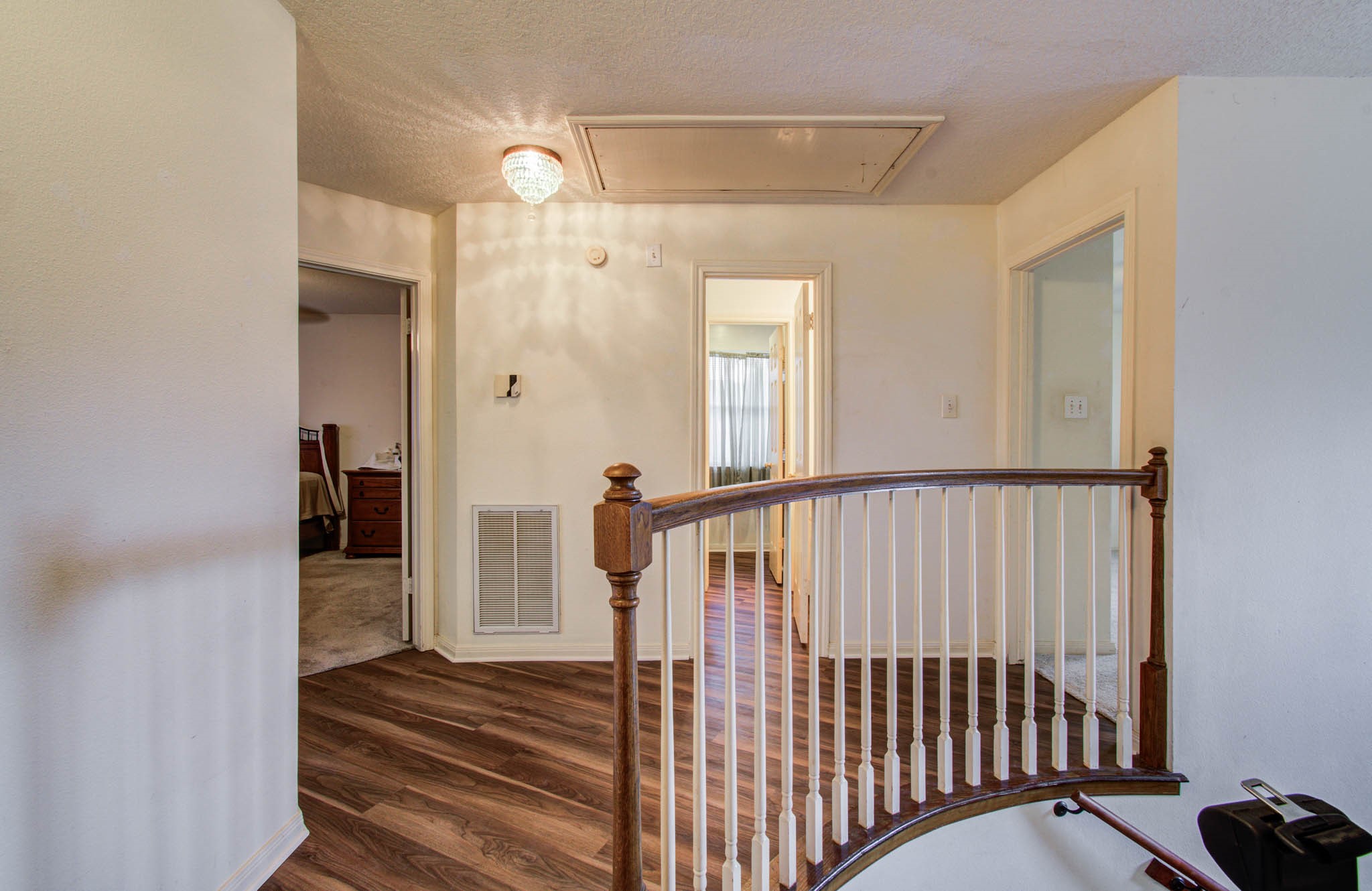 211 Squires Bend Stafford, TX 77477 - Photo 14 of 25 a view of a hallway with wooden floor and stairs