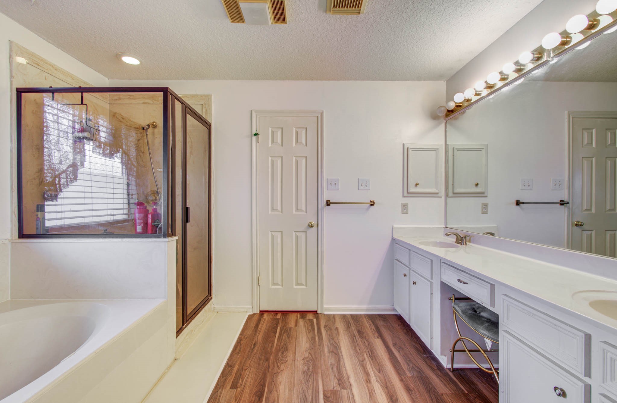 211 Squires Bend Stafford, TX 77477 - Photo 17 of 25 a bathroom with a tub sink and mirror