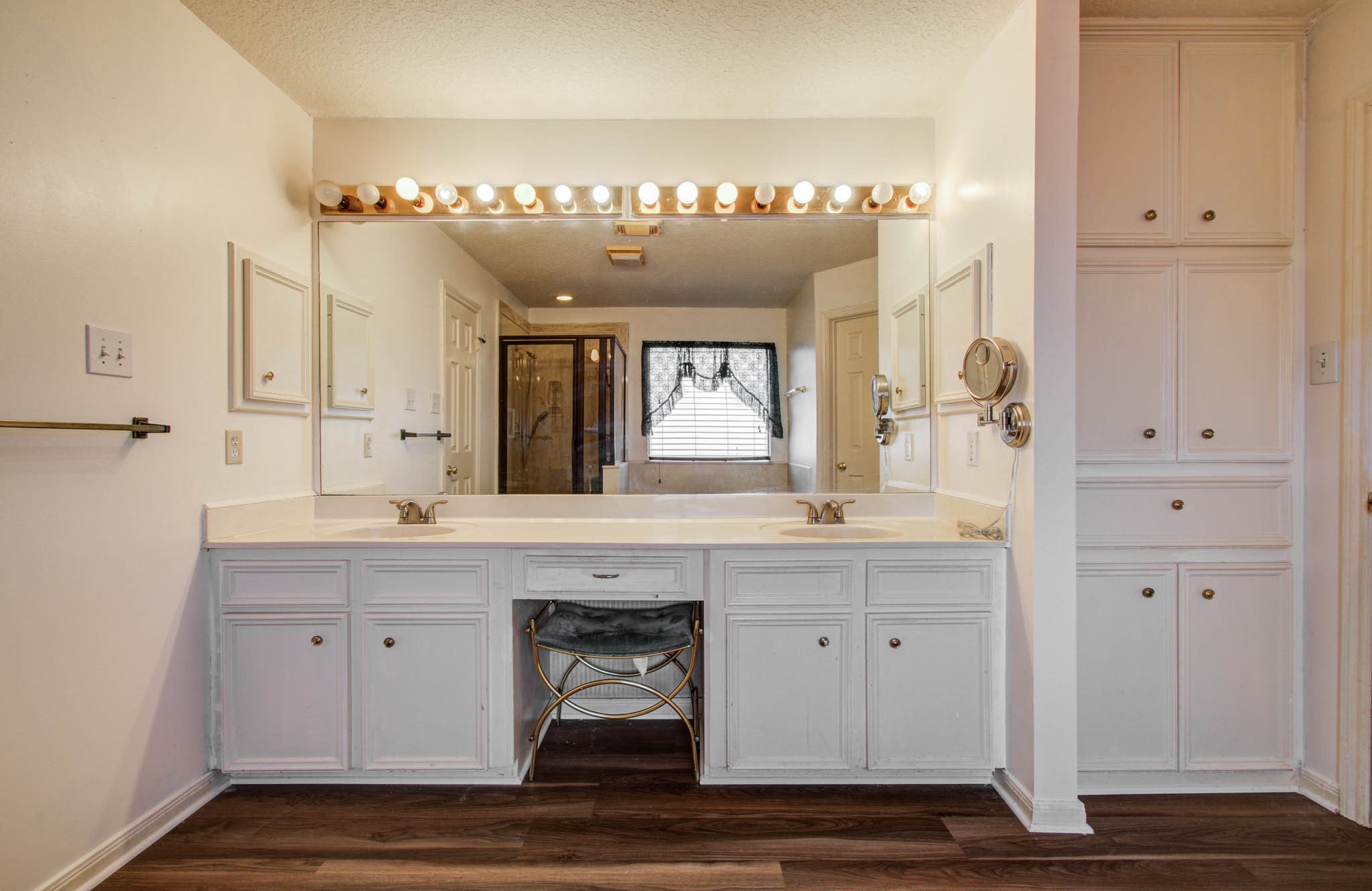211 Squires Bend Stafford, TX 77477 - Photo 18 of 25 a spacious bathroom with a sink a large mirror and a shower