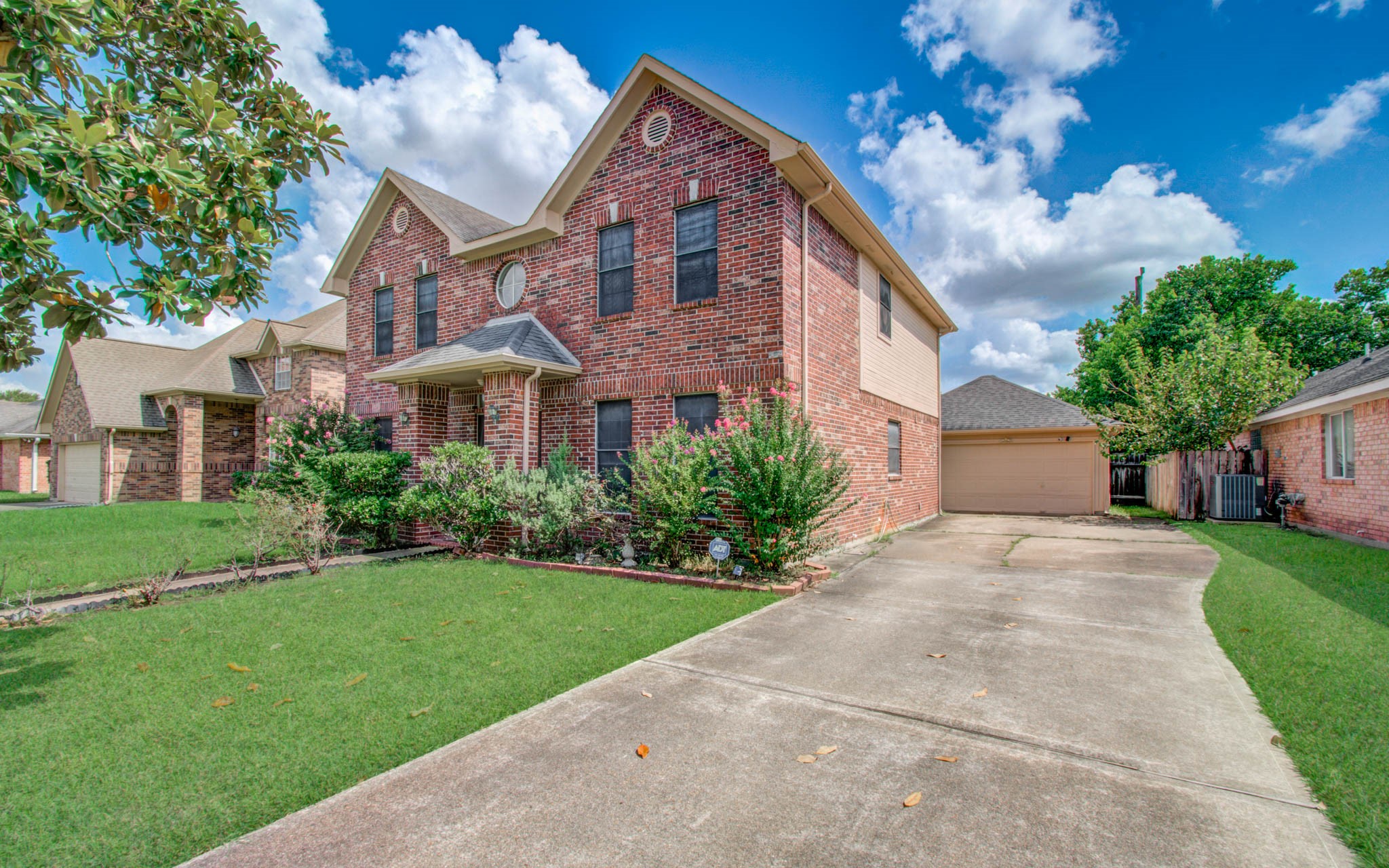 211 Squires Bend Stafford, TX 77477 - Photo 2 of 25 a front view of a house with a yard