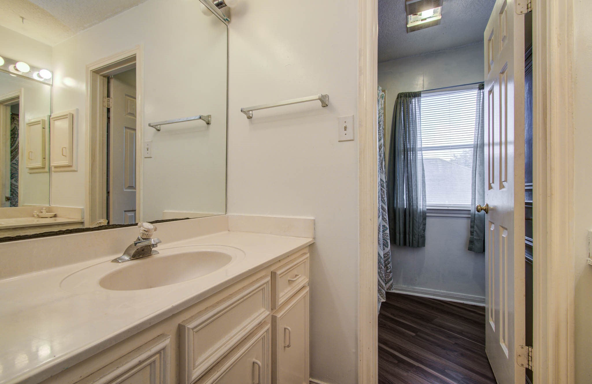 211 Squires Bend Stafford, TX 77477 - Photo 21 of 25 a bathroom with a sink and a mirror