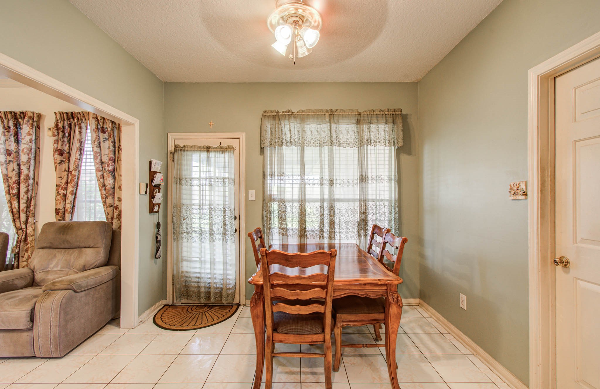 211 Squires Bend Stafford, TX 77477 - Photo 10 of 25 a living room with furniture and a floor to ceiling window