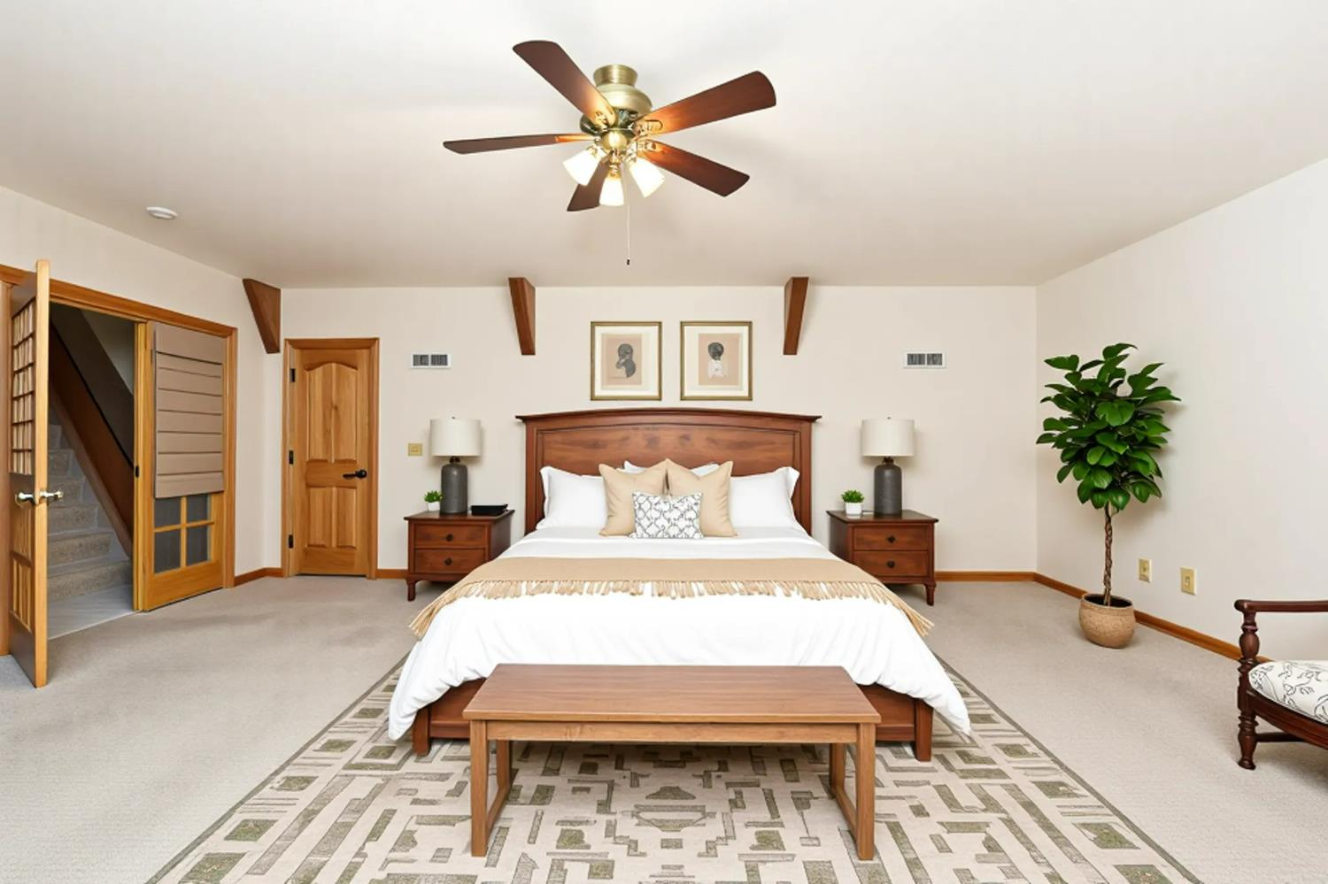 38303 Woodland Road Shaver Lake, CA 93664 - Photo 12 of 28 a spacious bedroom with a bed and a table in it