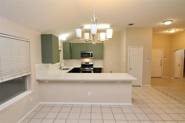 a view of room with white cabinets