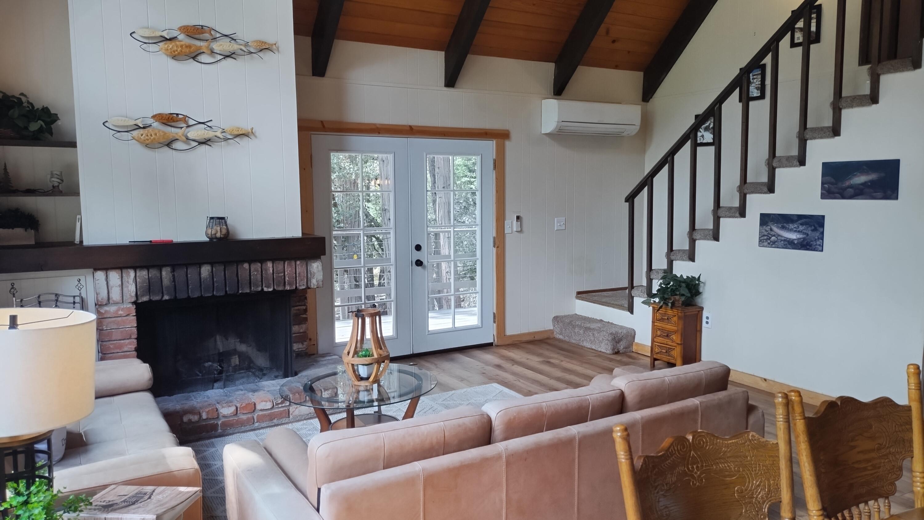 1693 Forest Rte 21S94 Camp Nelson, CA 93265 - Photo 6 of 86 a living room with furniture a fireplace and a potted plant