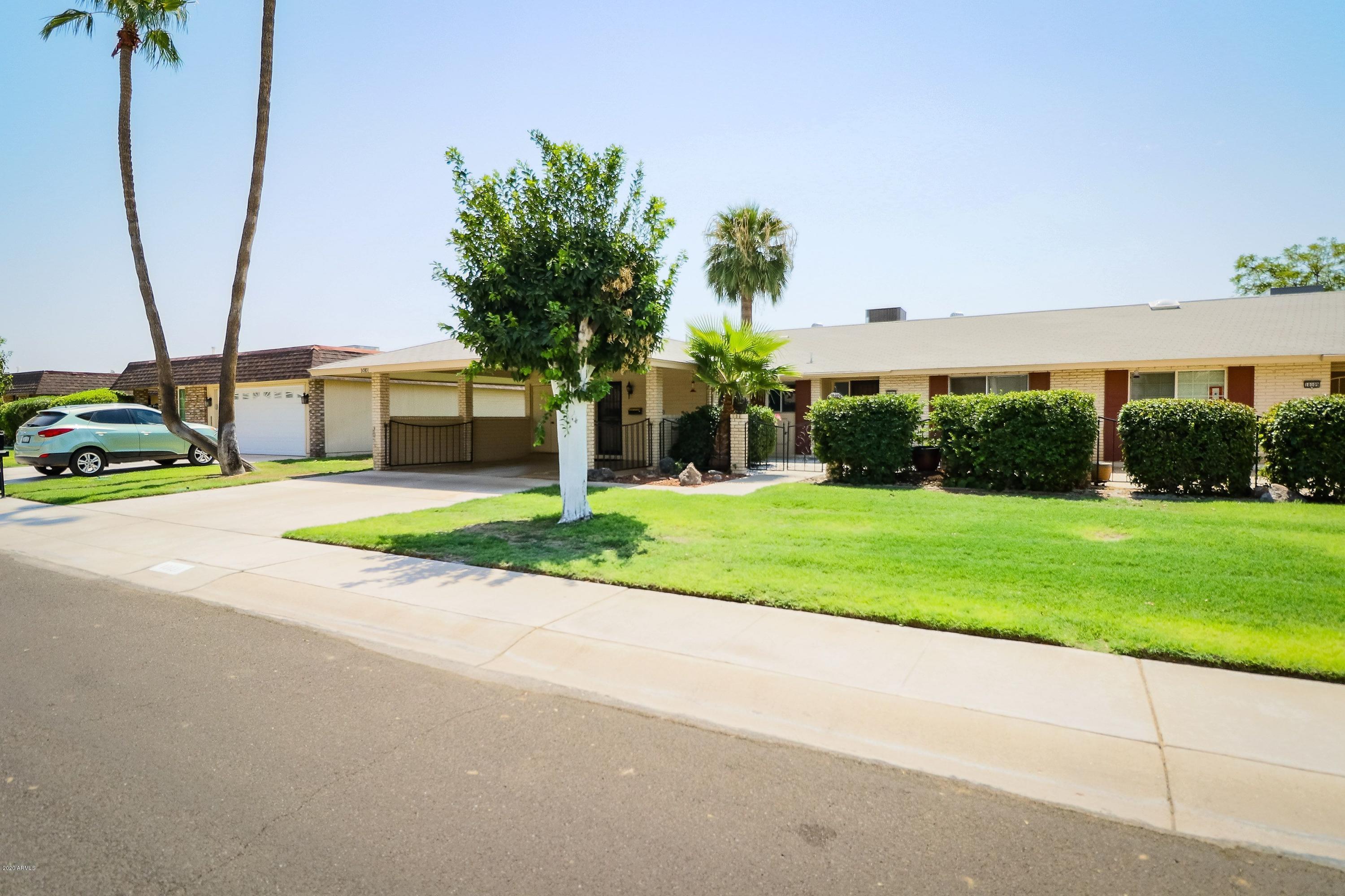 10101 West Mountain View Road Sun City, AZ 85351 - Photo 1 of 37 Wide Street & Front Lawn