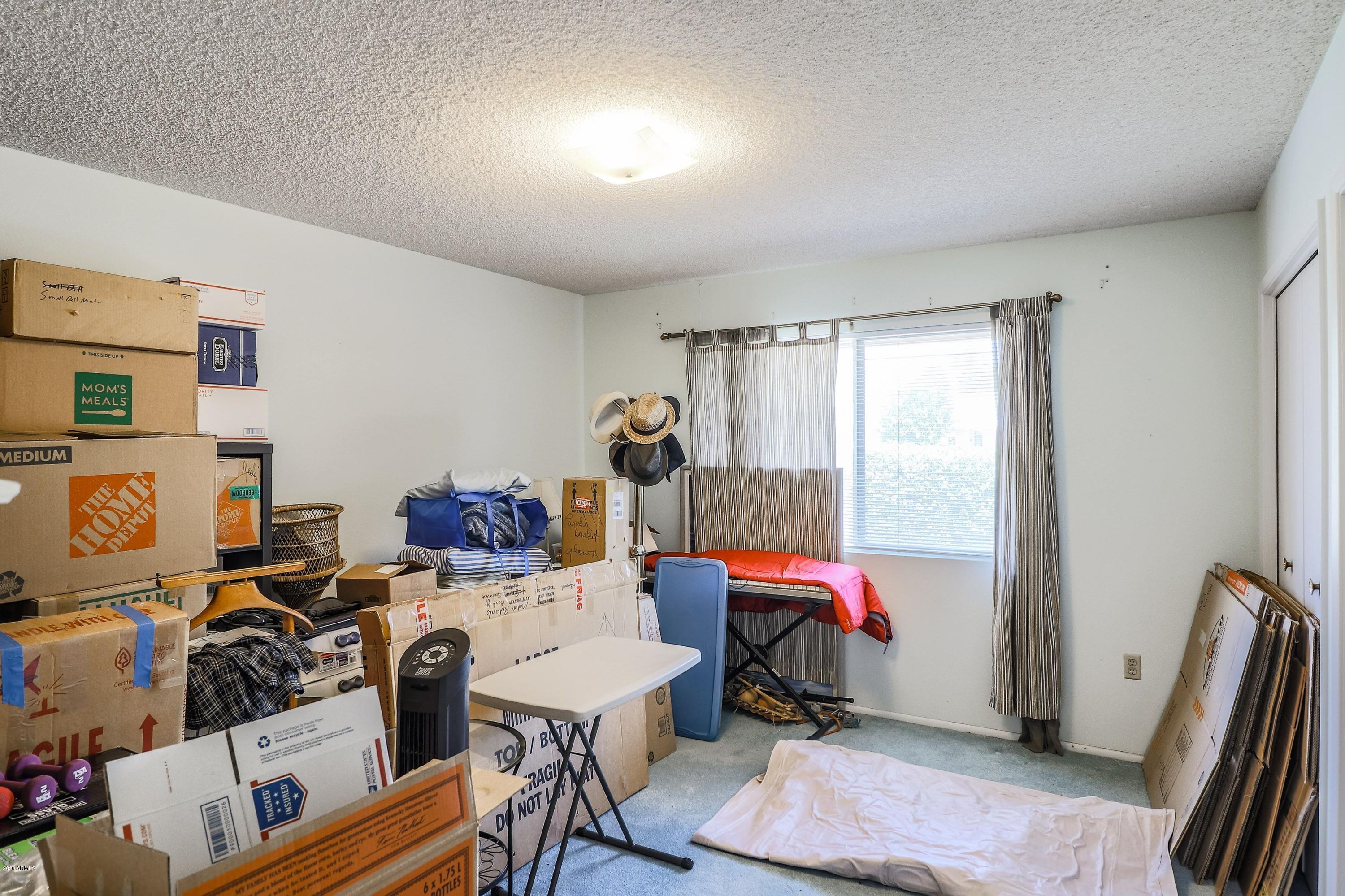 10101 West Mountain View Road Sun City, AZ 85351 - Photo 31 of 37 2nd Bdrm serving as moving Storage