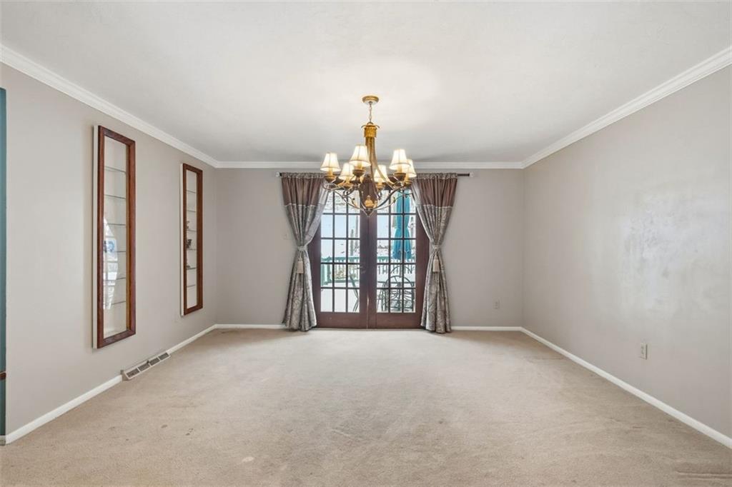 21 West Hillcrest Road Eighty Four, PA 15330 - Photo 16 of 48 Enjoy special meals in the spacious dining room that features full view atrium doors leading to a rear deck. The two built-in glass shelving units are perfect for special display items.