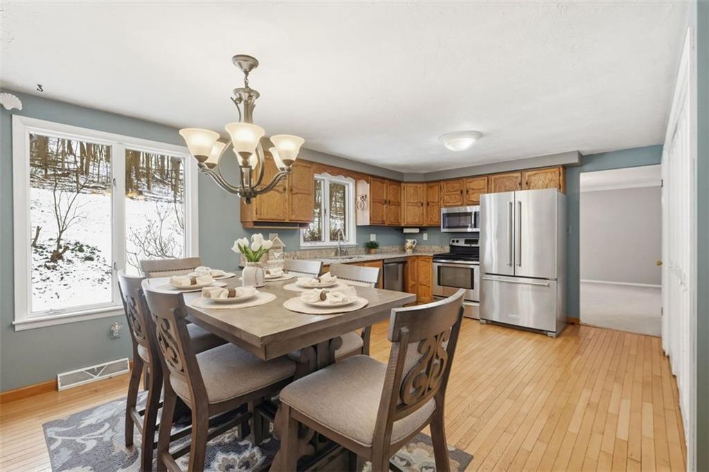21 West Hillcrest Road Eighty Four, PA 15330 - Photo 18 of 48 The sun drenched eat-in-kitchen is perfect for everyday living. The kitchen features, granite counter tops, stainless steel appliances, solid wood cabinetry, two pantries, utility closet and updated lighting and faucets.