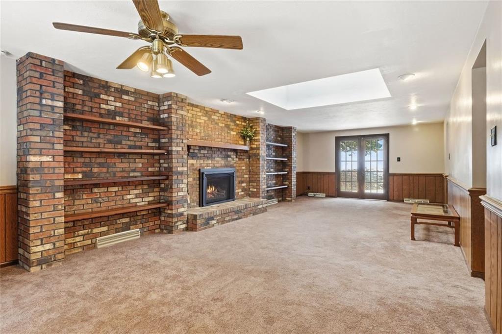 21 West Hillcrest Road Eighty Four, PA 15330 - Photo 25 of 48 The main level family room is perfect for all seasons. Enjoy all of the natural lighting that flows in from the front windows, rear atrium doors and large skylight.