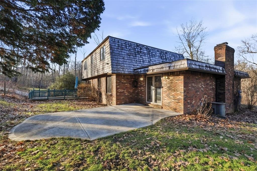 21 West Hillcrest Road Eighty Four, PA 15330 - Photo 43 of 48 The newer cedar shake roof along, gutters and facia all replaced in 2023...giving you peace of mind.