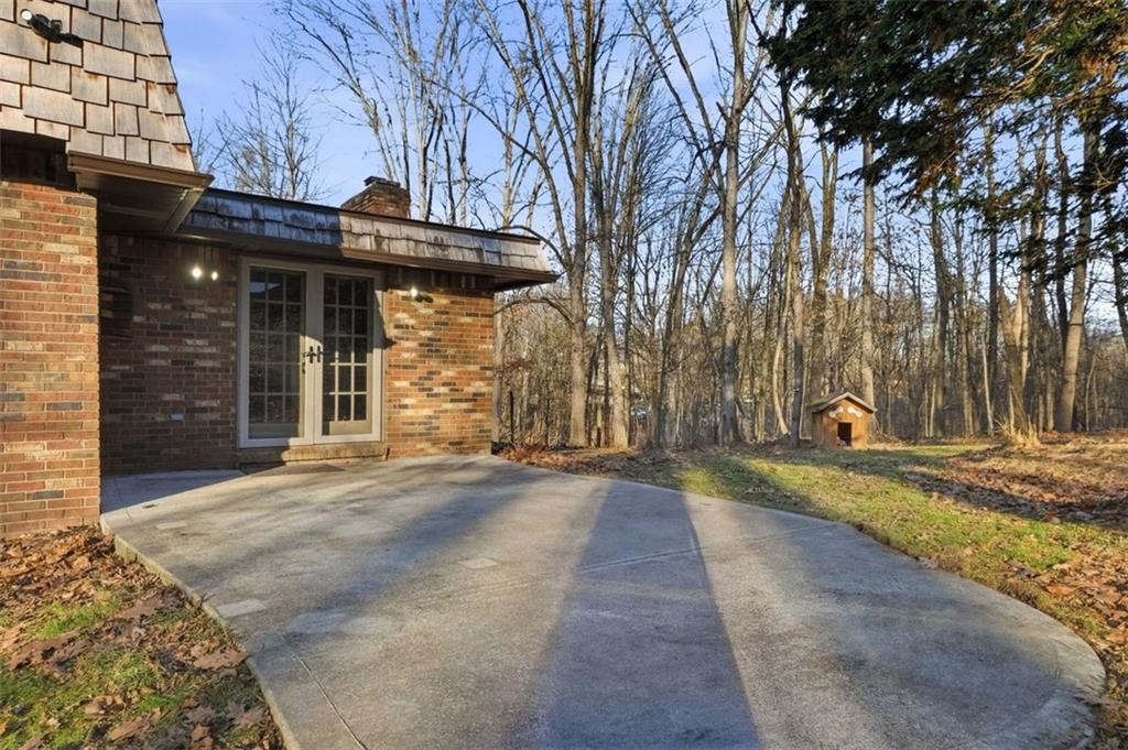 21 West Hillcrest Road Eighty Four, PA 15330 - Photo 44 of 48 The rear patio located off the main level family room is generously sized for plenty of outdoor furniture.
