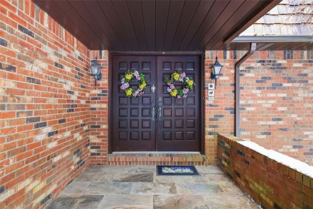 21 West Hillcrest Road Eighty Four, PA 15330 - Photo 8 of 48 A beautiful covered front porch is perfect for greeting guests. The front porch features stone tile flooring and a double door front entrance.