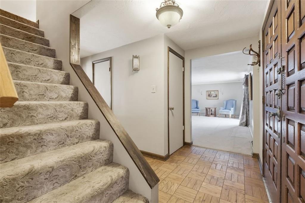 21 West Hillcrest Road Eighty Four, PA 15330 - Photo 10 of 48 The foyer opens to the living room, center hallway leading to a eat-in-kitchen and opens to a spacious main level family room.