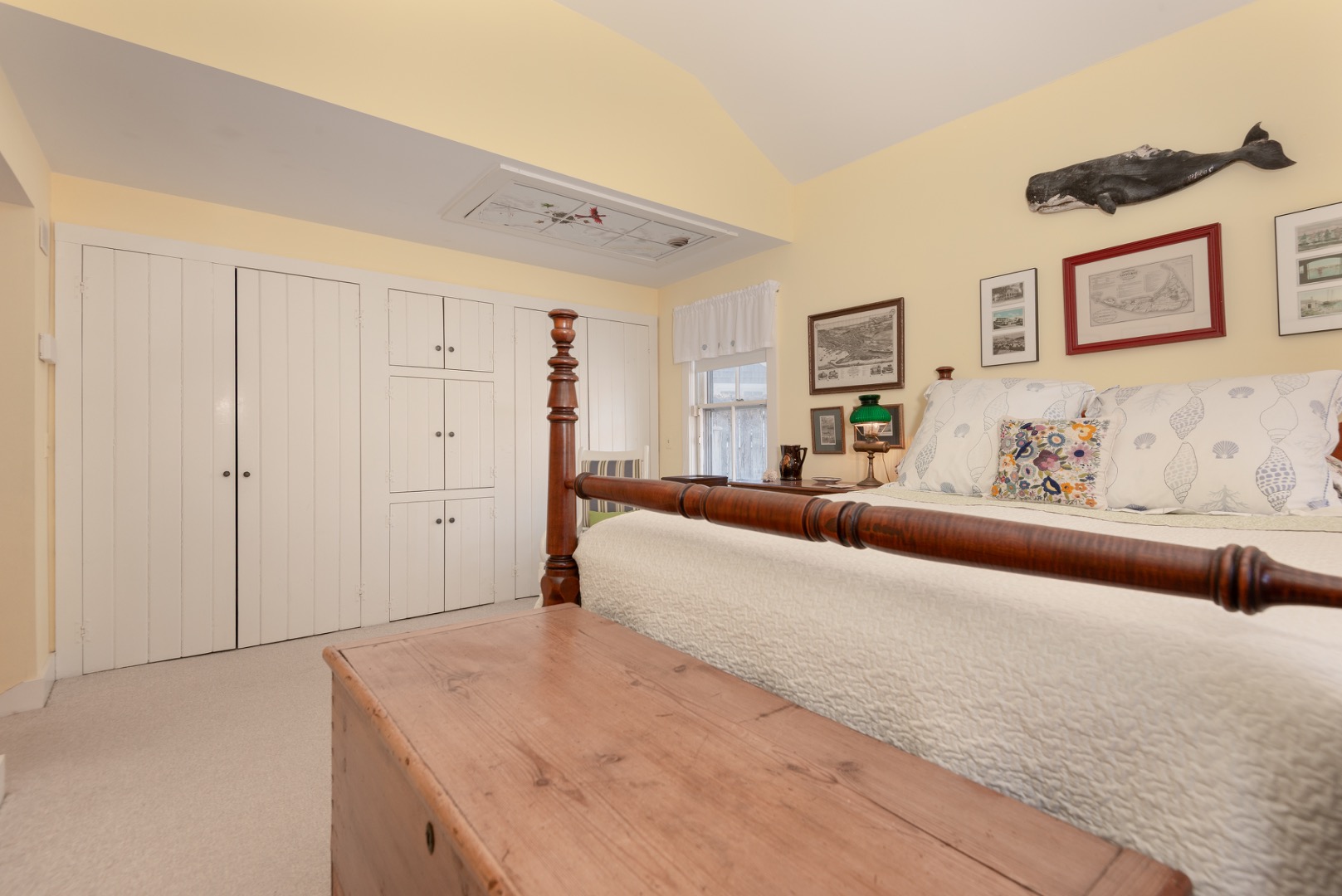 42 North Liberty Street Nantucket, MA 02554 - Photo 16 of 20 a spacious bedroom with a large bed and a couch