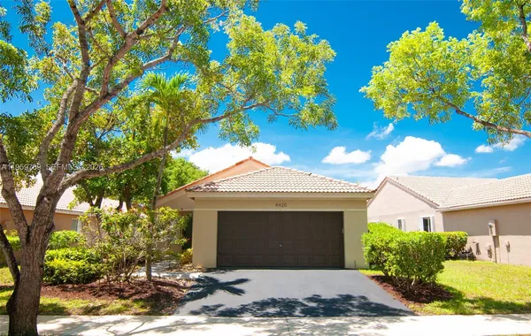 a front view of a house with a large window