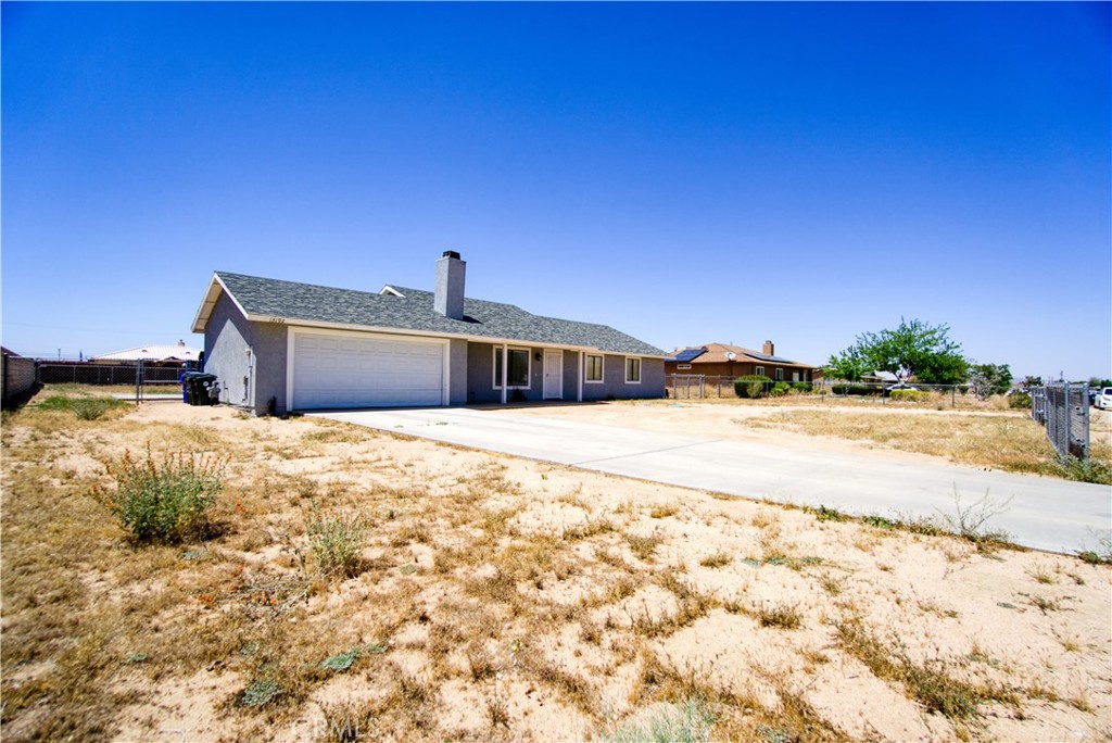 13192 Topock Road Apple Valley, CA 92308 - Photo 1 of 1 a bedroom with a bed