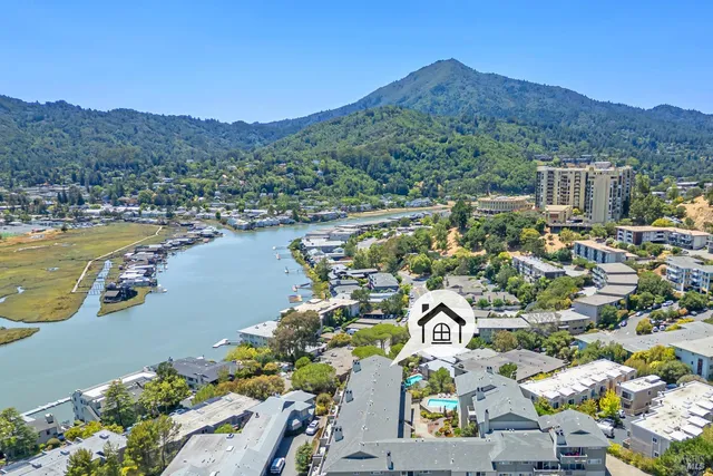 an aerial view of residential houses with outdoor space