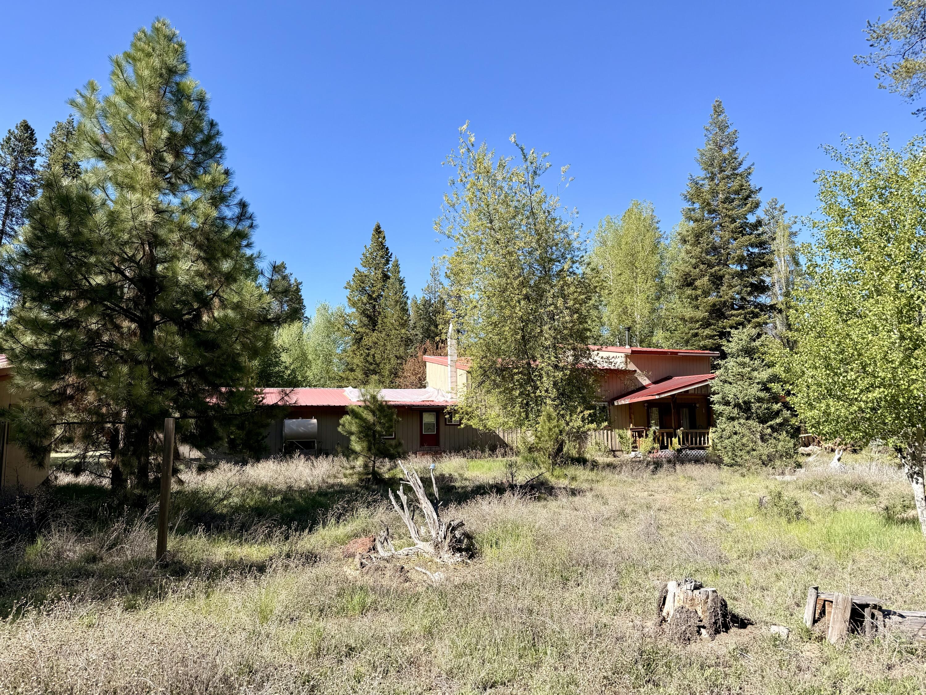 16025 Strawn Road La Pine, OR 97739 - Photo 77 of 95 a view of a chairs and fire pit in the yard