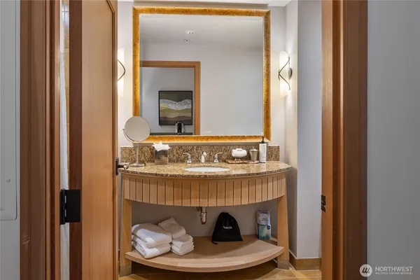 a room with a mirror and a table