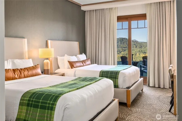 a bedroom with bed and a window