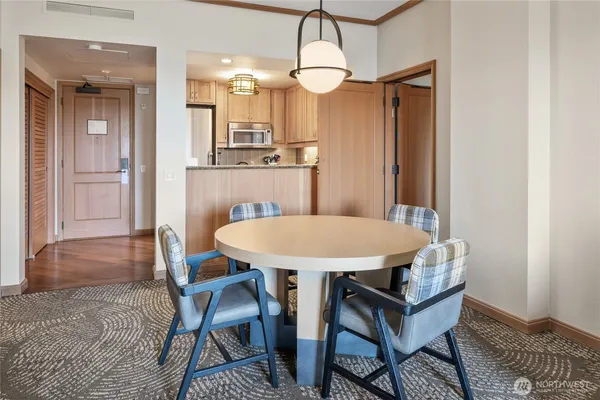 a dining room with furniture and window