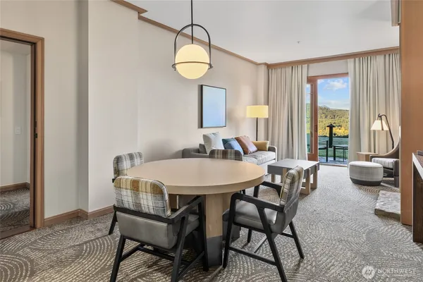 a dining room with furniture and window