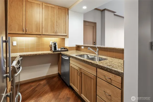 a kitchen with a sink and cabinets