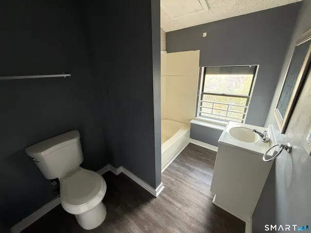 a bathroom with a toilet and a sink