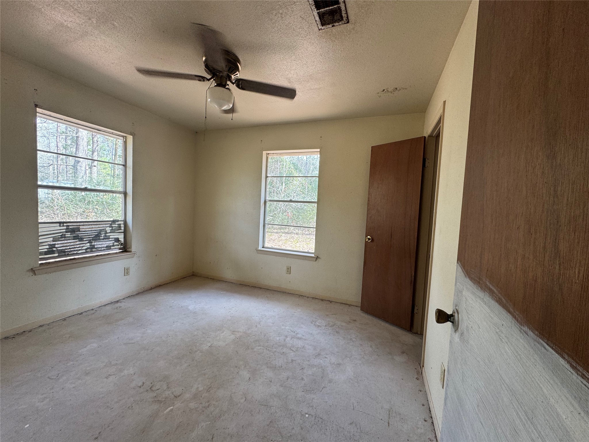 317 Bob Wills Road Livingston, TX 77351 - Photo 10 of 24 a view of an empty room with a window