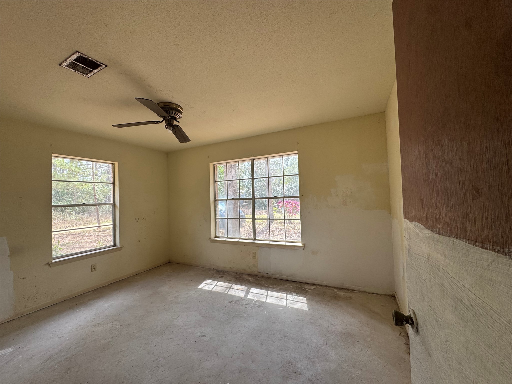 317 Bob Wills Road Livingston, TX 77351 - Photo 12 of 24 a view of an empty room with a window