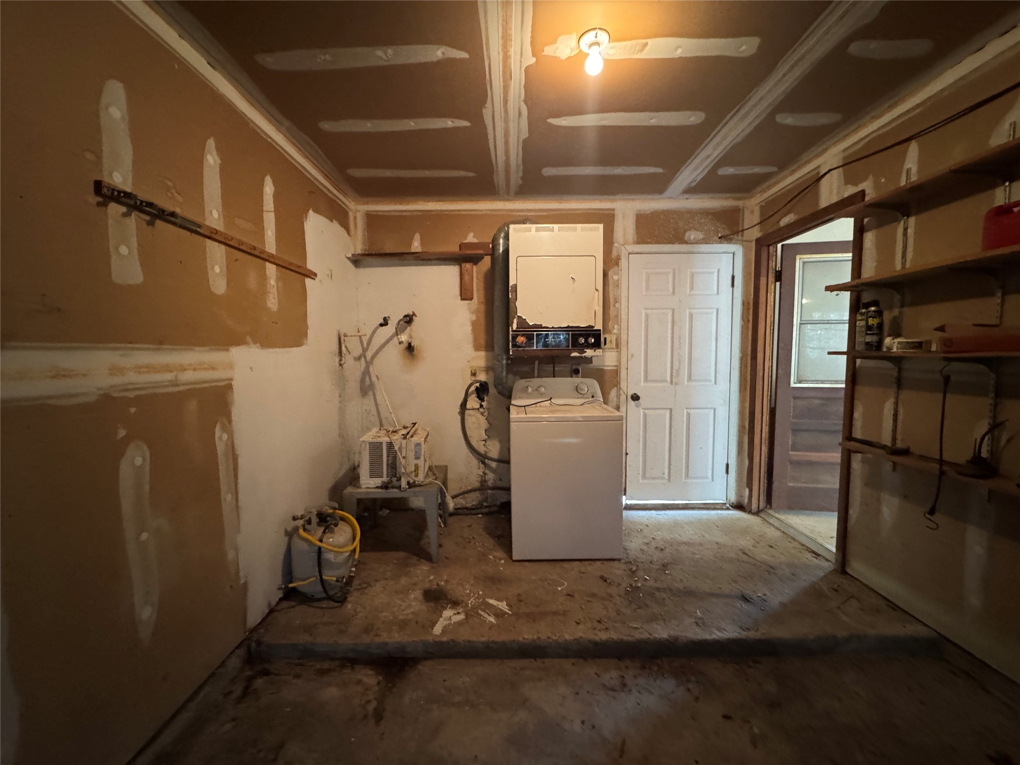 317 Bob Wills Road Livingston, TX 77351 - Photo 19 of 24 a room with water heater and storage