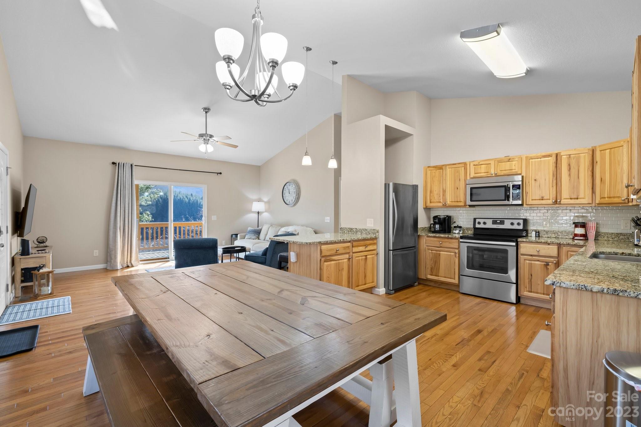 174 Diamond Point Canton, NC 28716 - Photo 12 of 43 a kitchen with stainless steel appliances granite countertop a stove refrigerator and a sink