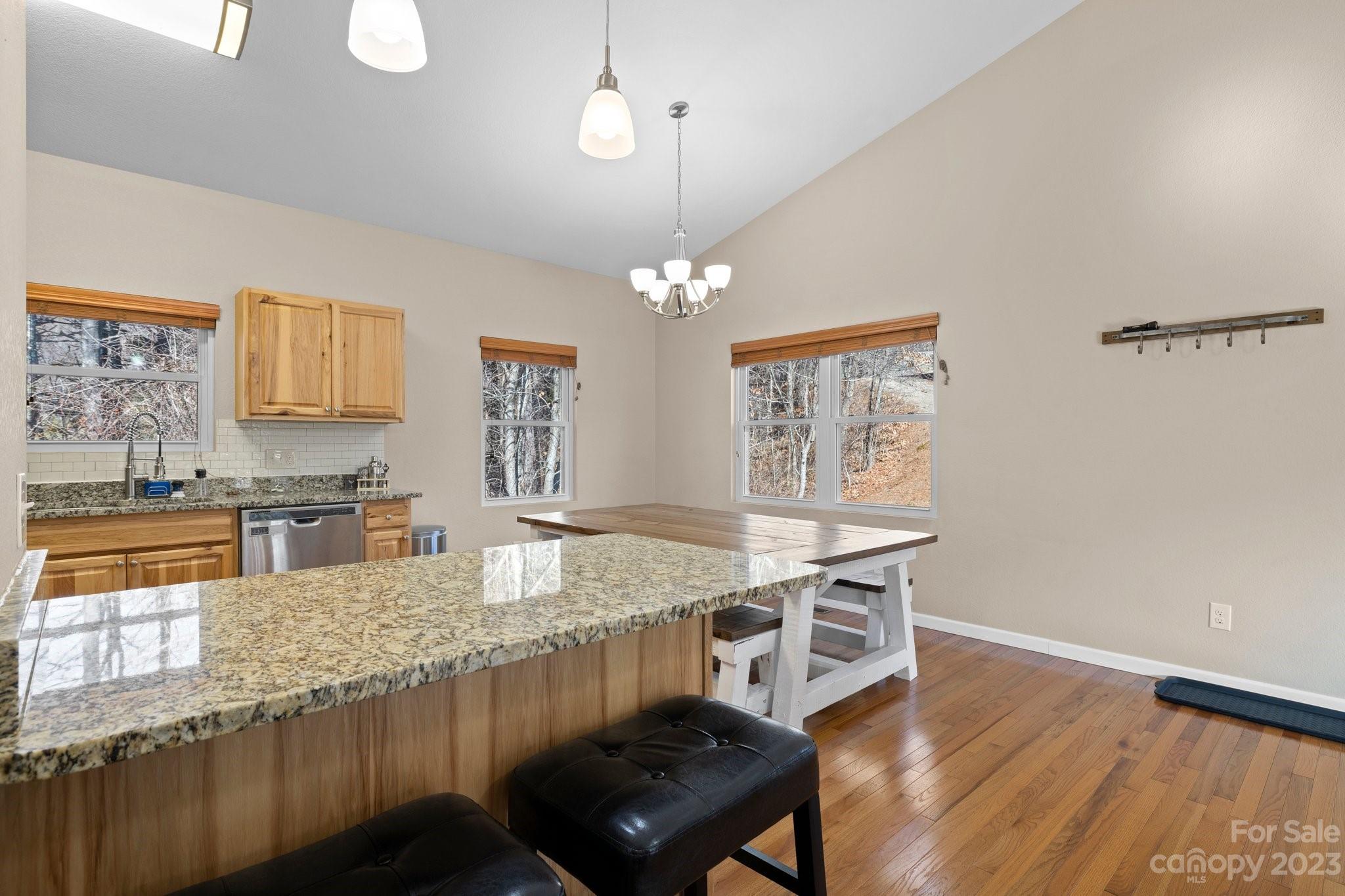 174 Diamond Point Canton, NC 28716 - Photo 14 of 43 a kitchen with stainless steel appliances granite countertop a stove a sink and a microwave
